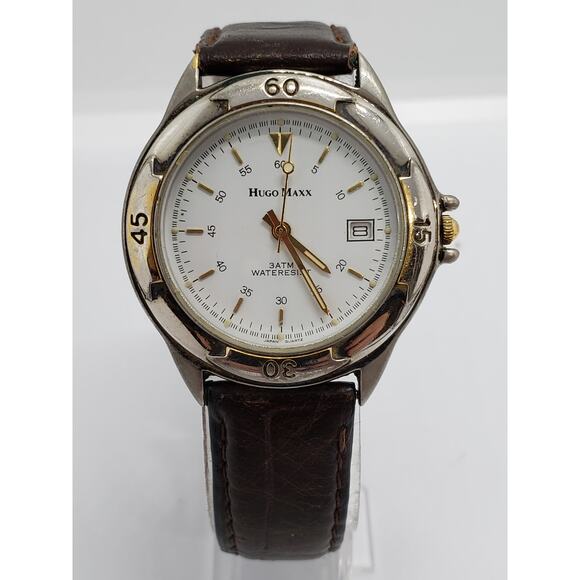 Hugo Maxx men's dress watch. Calendar on face. Gold accents 13448 Working watch